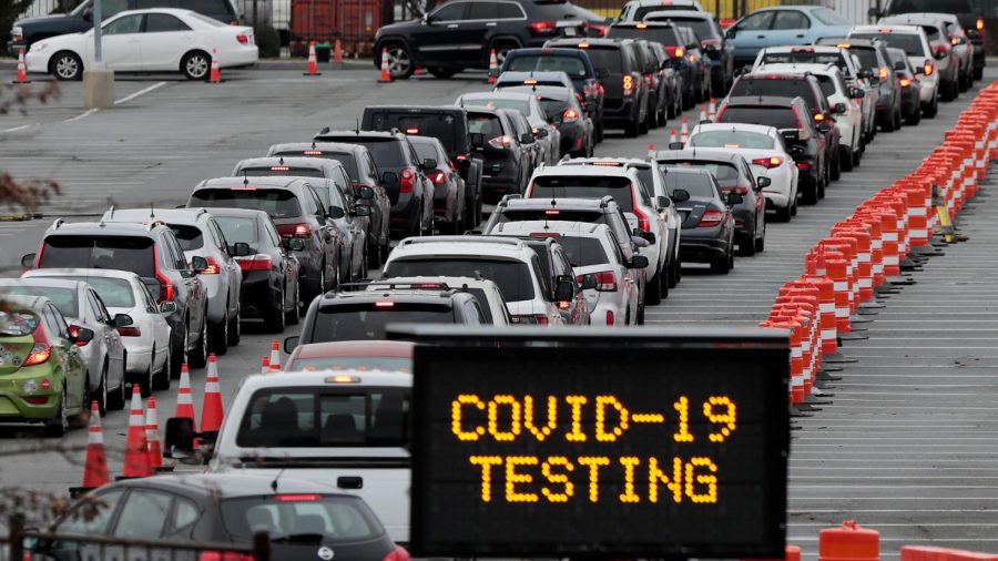 Cars wait it long lines in hopes of getting tested for COVID.

Credits: SouthCoastToday.com